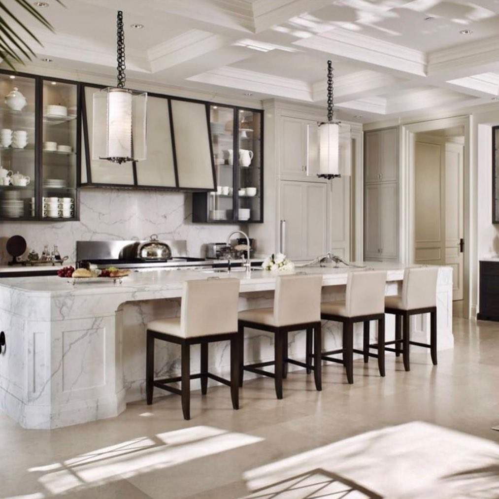 An incredible kitchen by Canadian Designer @briangluckstein - Brian’s style has a strong emphasis on symmetry and is effortlessly comfortable, neoclassical inspired, soft and neutral, always elegant, yet never boring due to the right mix of eclecticism – juxtaposed eras and materials. Says Brian himself: “The interest of a good interior is in the mix, the tension between contemporary and past designs” - Check out the full interview on www.lifeMstyle.com - link on profile 
.
.
.
.
.
#briangluckstein #brianglucksteindesign #glucksteinhome #ivanmeade #lifemstyle #lifemstyleblog #interiordesign #canadiandesigner #canadianinteriors #instadesign #picoftheday #kitchen #kitchendesign #kitchenisland #library #fireplace